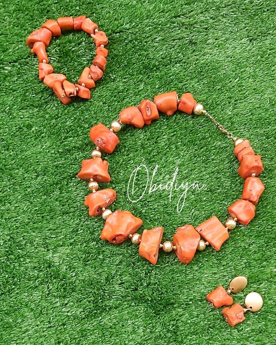orange single strand bamboo coral with gold accessories